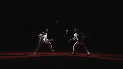 two fencers in a competition