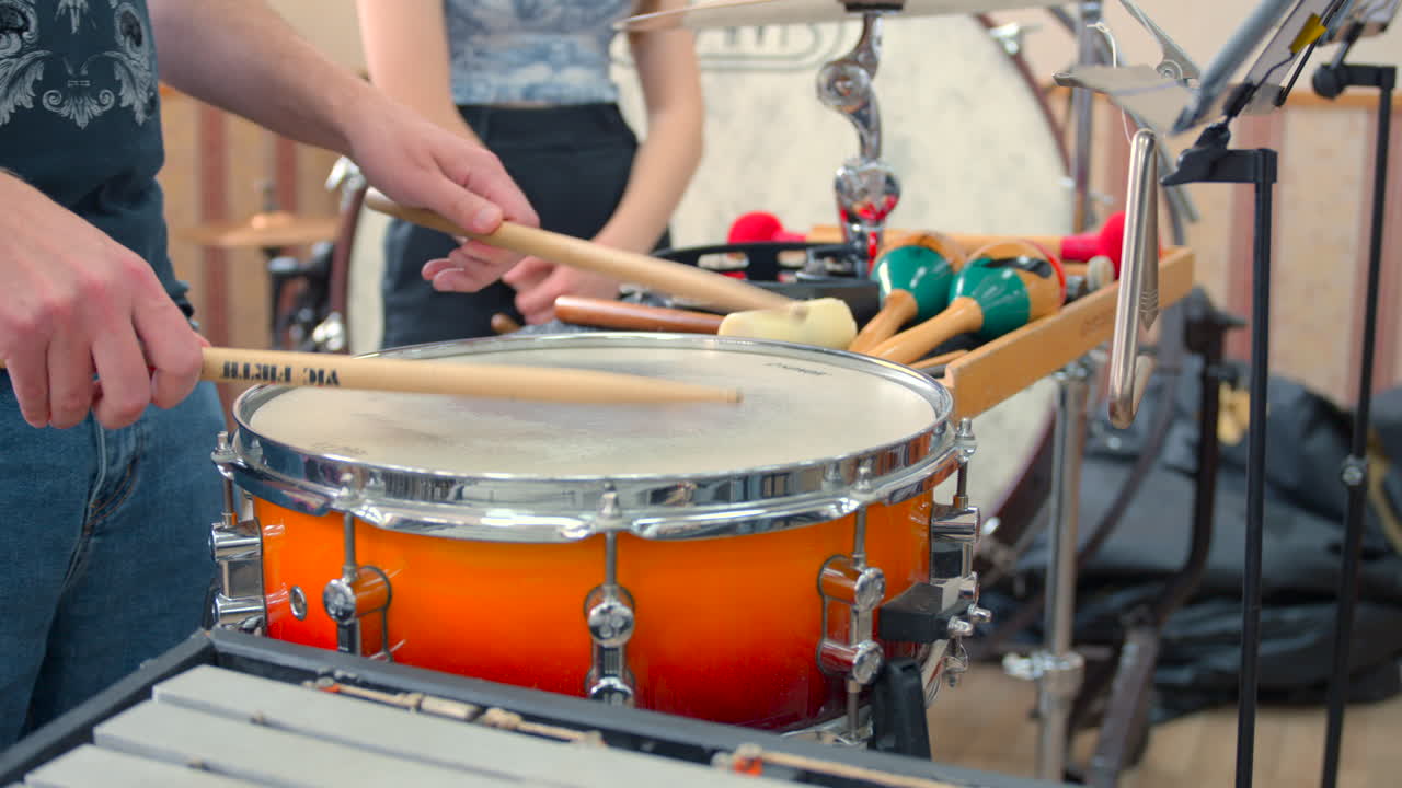 Close-up of drummer playing percussion instruments