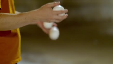 close-up of bounce juggling hands in slow motion