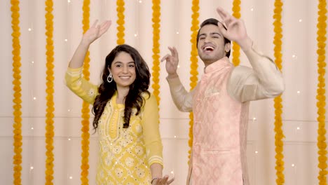 Indian-couple-dancing-at-some-festival