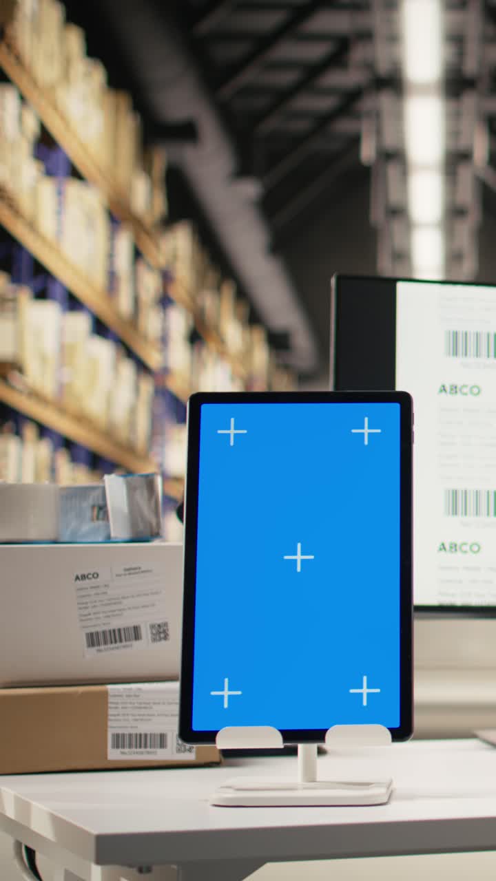 Vertical Video Male warehouse clerk printing barcode labels next to chroma key displays