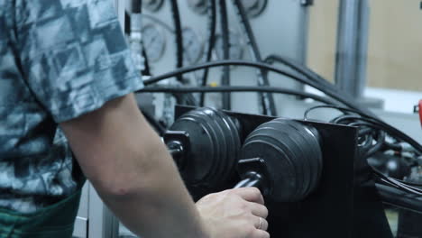 worker hand managing automated production line with joystick