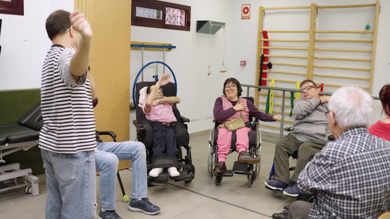 Group physical therapy session with people in wheelchairs