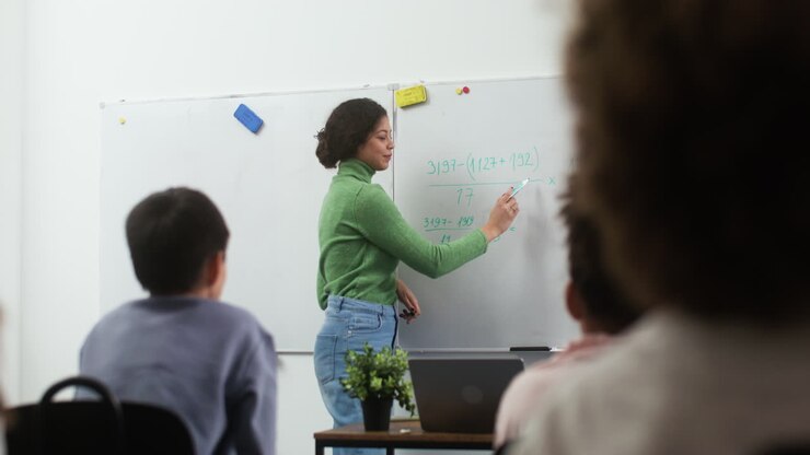 Teacher and students at school