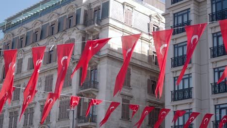 turkish flags hanging on a street in istanbul