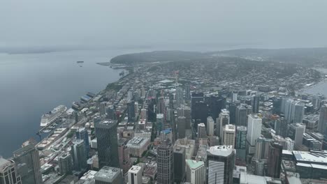 Aerial-view-of-Seattle's-skyscrapers-surrounded-by-fog