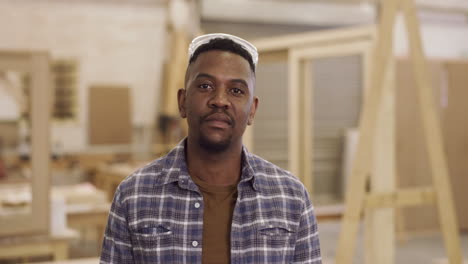 smiling carpenter in workshop