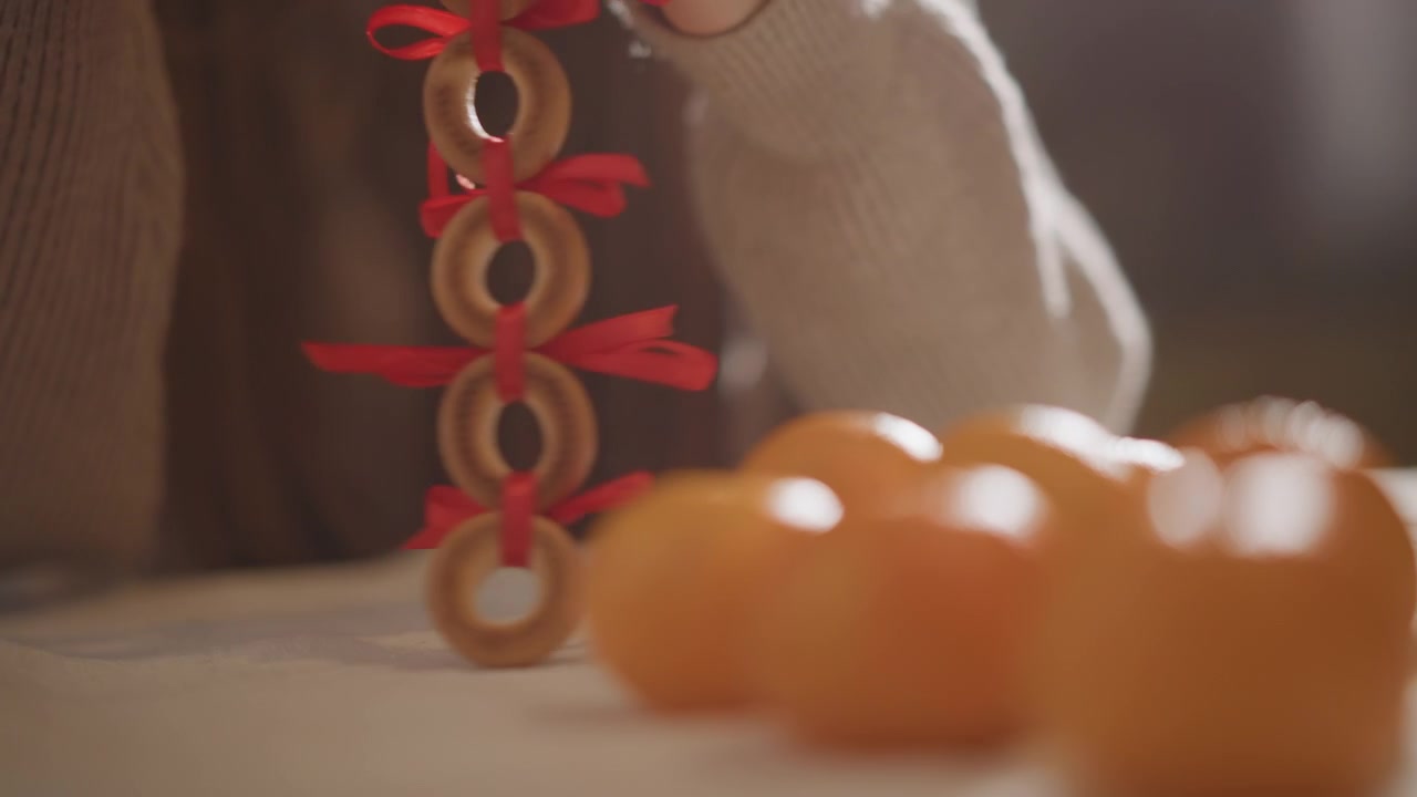 Warm bokeh highlights delicate linen textures. Gentle blurring emphasizes ribboned bagel and tranquil mood. Muted colors and tactile textures evoke calmness and subtle citrus atmosphere