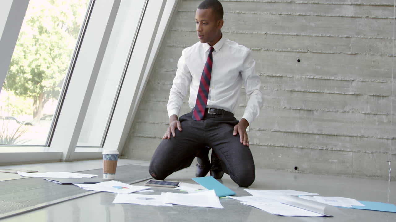 Businessman Lays Plans For Project On Floor Shot On R3D