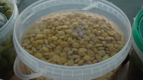 closeup detail shot of superfood yellow lupin or lupini beans in brine