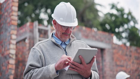 construction site engineer using tablet