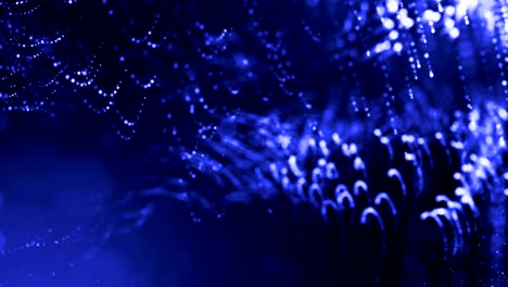 3d render of luminous particles as science fiction background or modern abstract blue background of particles with depth of field and bokeh like vj loop. particles form line and wavy structure. 1