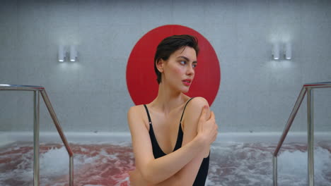 woman relaxing in a modern spa hot tub