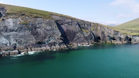 A-drone-shot-of-the-rugged-coastal-terrain-of-the-Dingle-Peninsula,-near-Dingle-Point,-in-Ireland