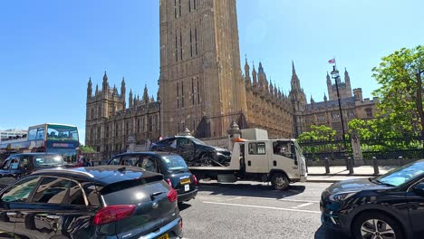 vehicles passing by big ben in london