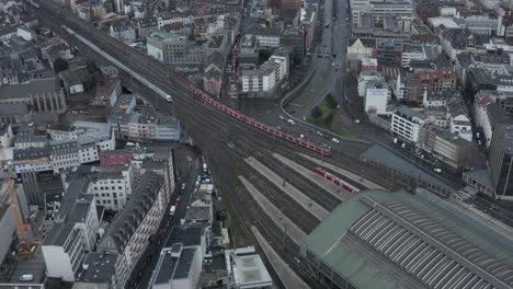 High-angle-view-of-traffic-on-railway-line-at-Main-train-station.-Connected-units-on-commuter-trains.-Cologne,-Germany