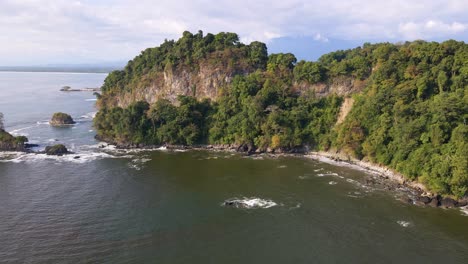 aerial footage of a secluded beach at high tide near manuel antonio, costa rica