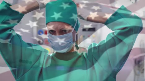 animation of flag of usa waving over surgeon in operating theatre