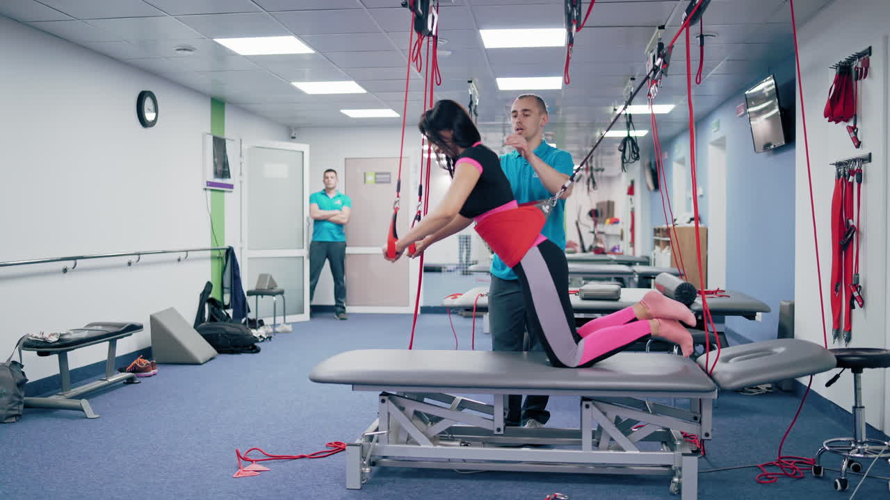 Female patient during rehabilitation. Modern rehabilitation physiotherapy man at work with woman client