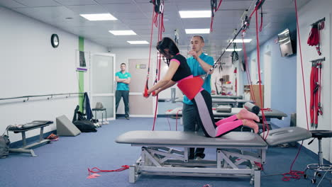 female patient during rehabilitation. modern rehabilitation physiotherapy man at work with woman client