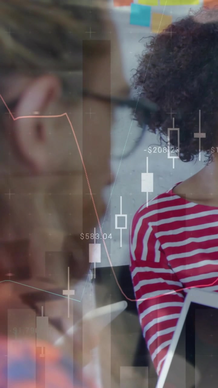 Vertical video: Bearded man observing while tablet user tapping and showing market chart for review