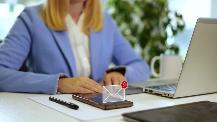 Woman working from coworking space, receiving emails on phone, motion graphics