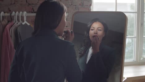 businesswoman doing make up in the morning