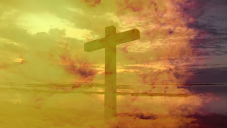 animation of a christian cross over moving clouds