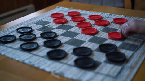 closeup shot of a game of checkers with soft focus, a strategic intellectual game