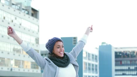 happy woman raising her hands up