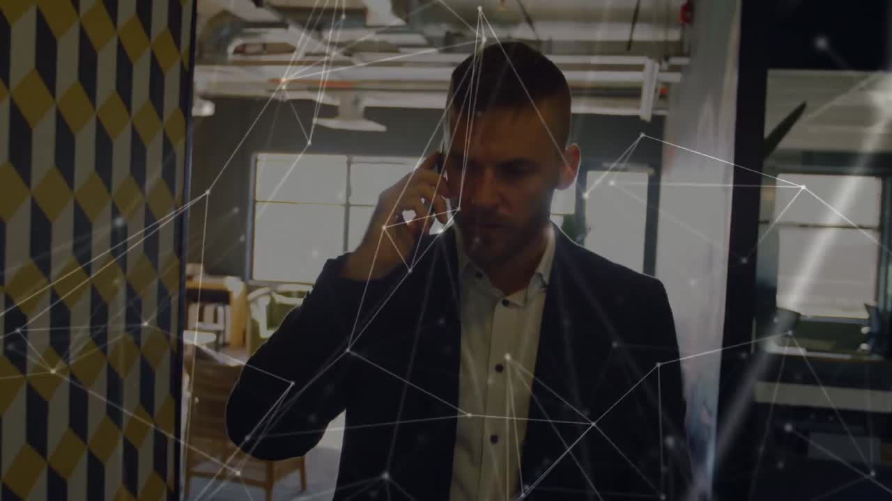 Animation of network of connections over caucasian businessman using smartphone