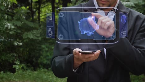 businessman uses hologram with piggy bank