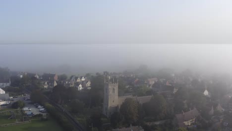 drone shot pulling away from islip church in mist 01