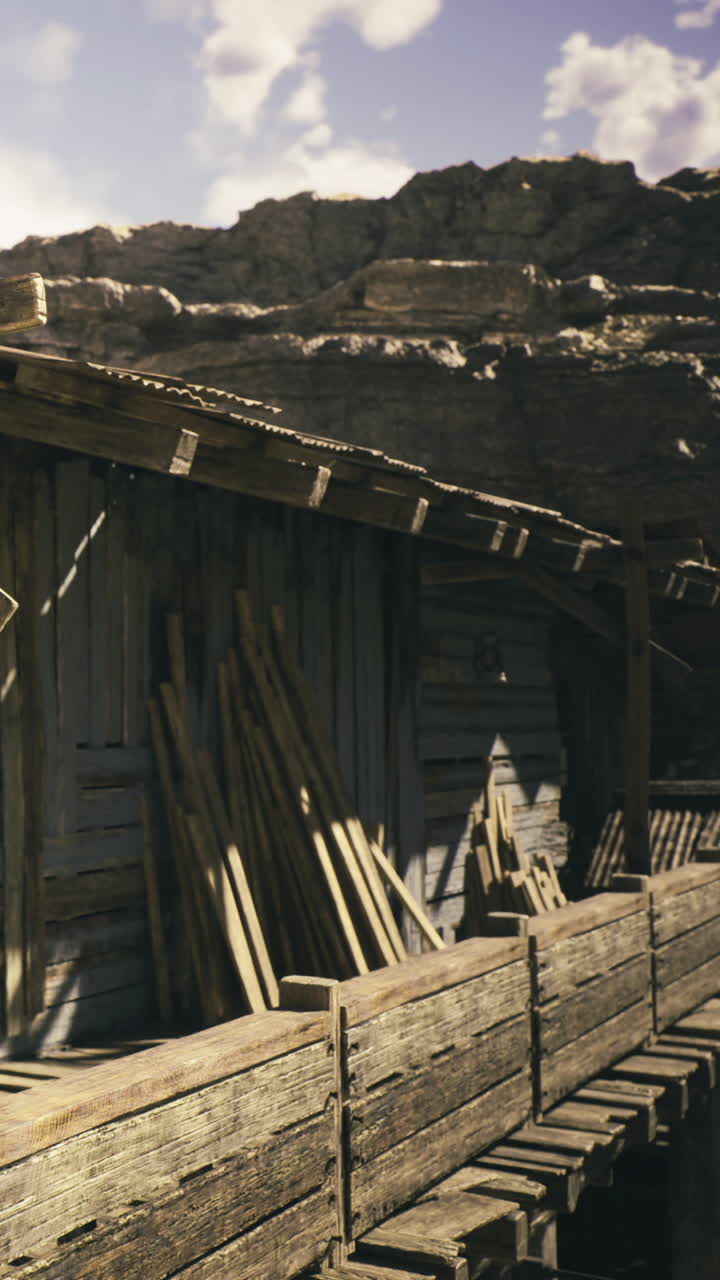 Struttura rustica in legno immersa in un sereno paesaggio montano.