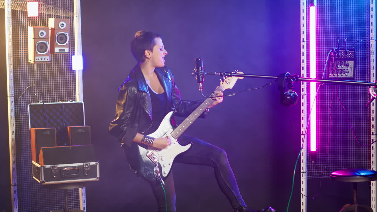 Female Musician Performing with Guitar and Microphone