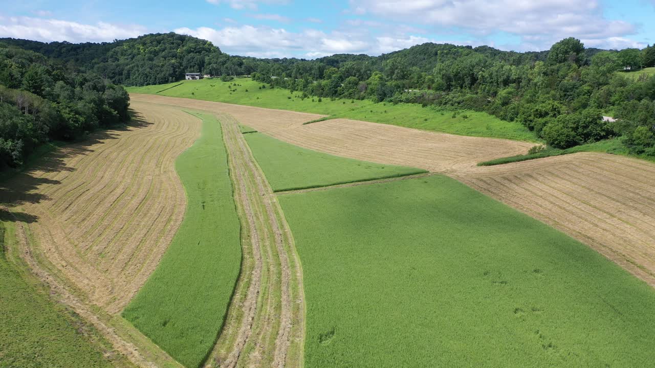 Aerial View of Farmland with Winding Fields and Hills