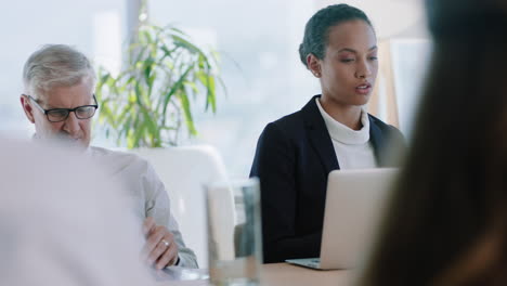 beautiful-business-woman-in-boardroom-meeting-using-laptop-computer-working-on-company--project-with-colleagues-sitting-at-table-planning-success-strategy-in-office-4k