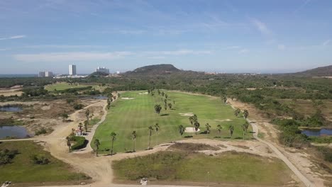 Aerial-View-of-Golf-Course-Fairway,-Empty-Vast-Green-Lawn-Field-Land-in-Sunny-Summer-Day,-Outdoor-Sports-Club