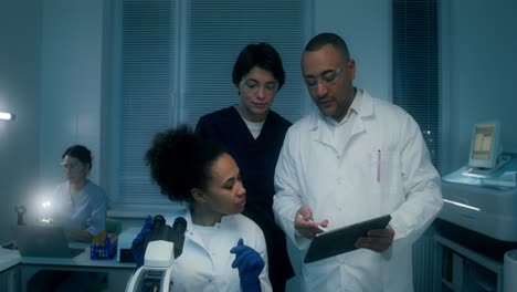 scientists discussing data in a laboratory