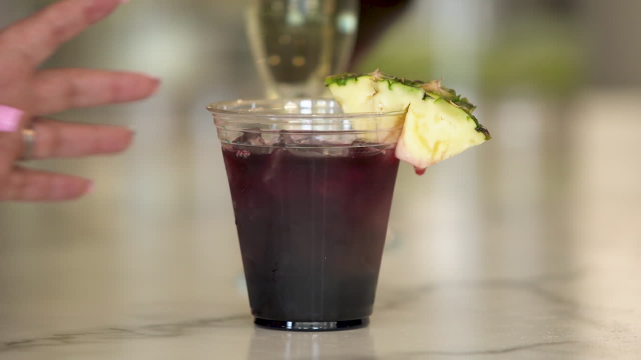 close ups grabbing selections of mixed alcoholic drinks at a spa bar