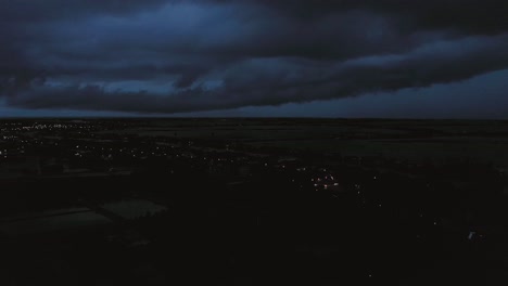 aerial crane shot view of of evening storm over mekong delta in vietnam from light to dark