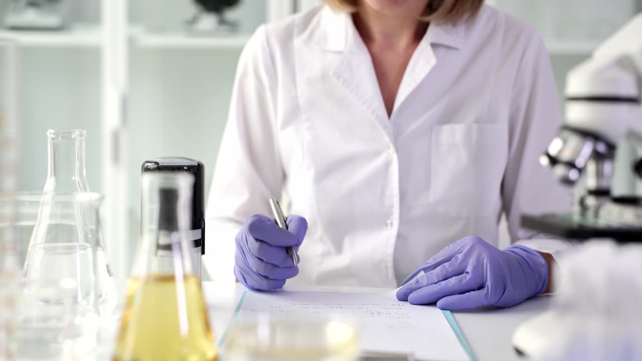 Scientist stamping documents in the lab