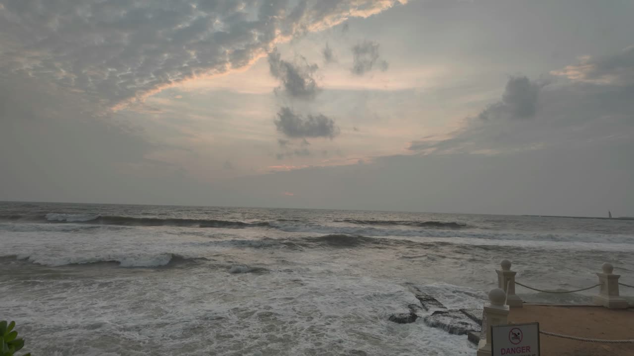 4K video of the Indian Ocean when sunset it near on a cloudy day