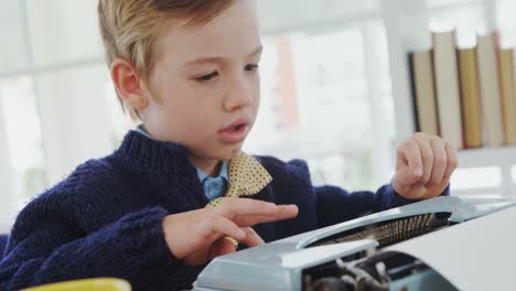 Boy-working-on-typewriter-in-the-office-4K-4k