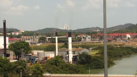 Traffic-and-buildings-around-Miraflores-Locks,-Panama-Canal