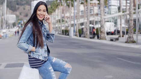 trendy attractive young woman in a denim outfit