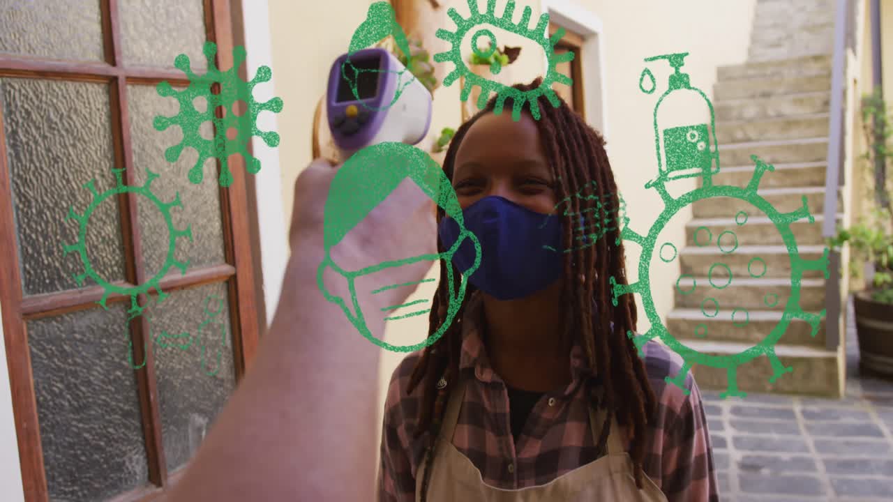 animación de iconos de virus sobre una mujer afroamericana con máscara facial tomando la temperatura