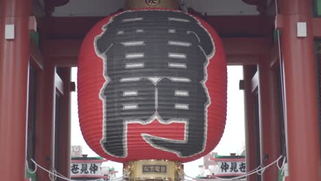 huge japanese lantern hanging in kaminarimon gate in asakusa, tokyo, japan - close up