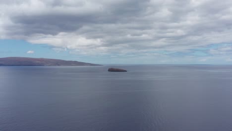 aerial close-up push-in shot of molokini crater and the sacred island of kaho'olawe off the coast of south maui, hawai'i