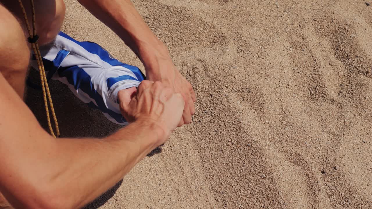 Setting up a beach umbrella on the beach